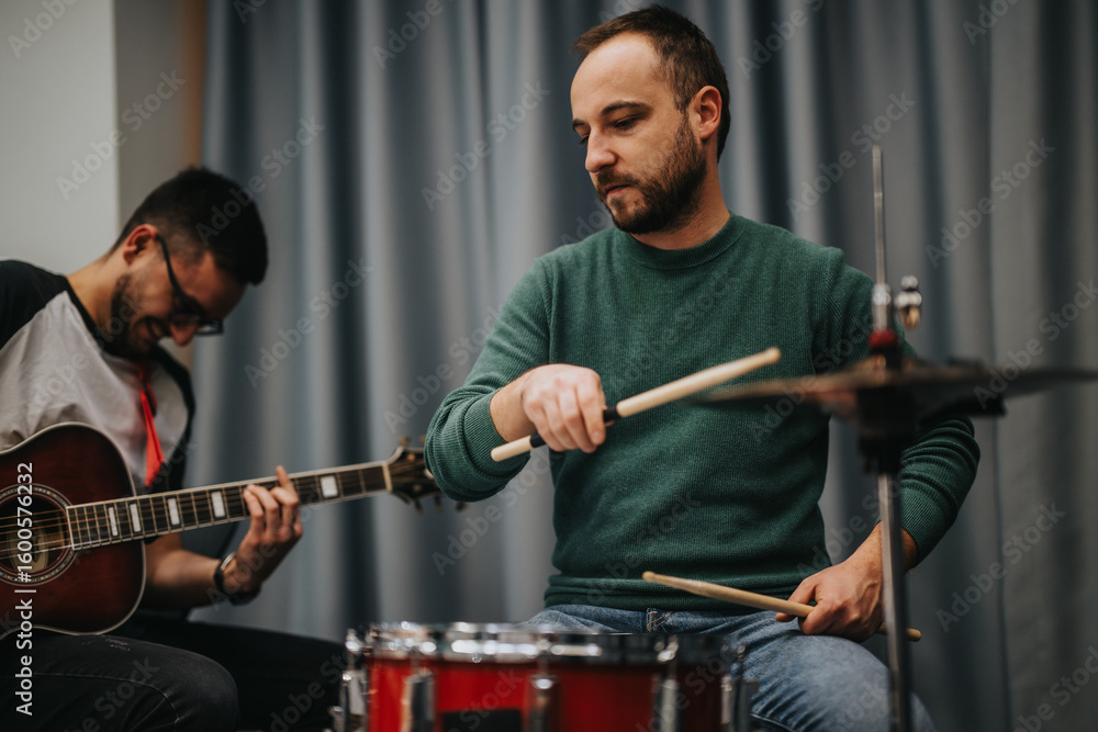 Fototapeta premium A dynamic scene of musicians playing instruments together, focusing on teamwork and creativity. Captured in an intimate indoor studio atmosphere, highlighting their dedication to music and live