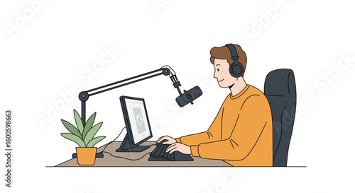 Young man podcasting while sitting at desk with microphone and laptop  