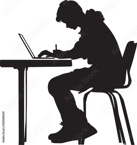 A student seated at a desk, writing notes in a notebook or on a laptop.