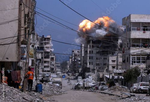 Aftermath Of A Strike In Gaza City Showing Destruction And Smoke