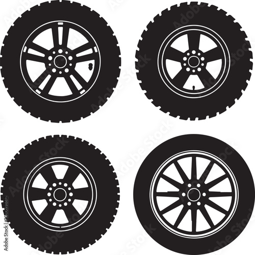 Four black car tires with white rims wheels