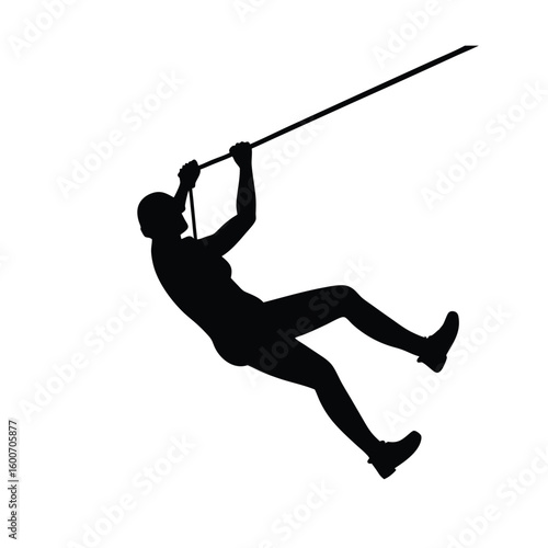 Silhouette of a person ziplining, silhouette of a zipliner hanging upside down mid-ride