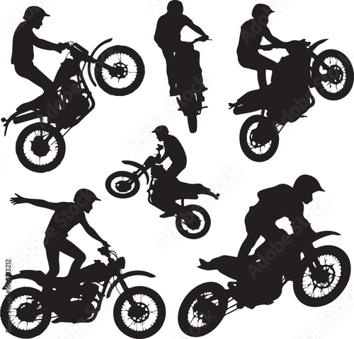 Motorcyclists performing stunts on dirt bikes motorcycle