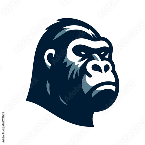 Close up profile of a powerful and intimidating gorilla head with a stern expression and dark fur