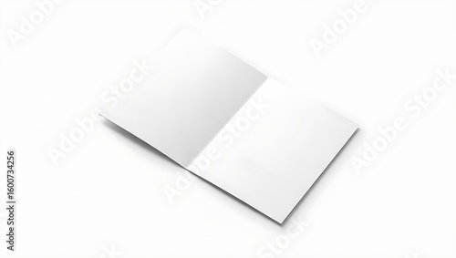 An open white card resting on a white surface casting a shadow creating a clean and simple image