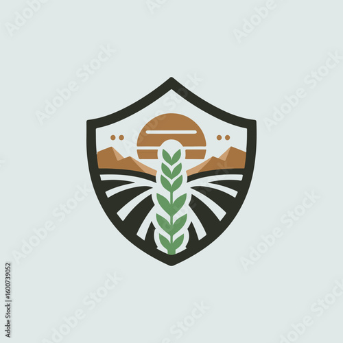 Shield emblem featuring a stylized wheat stalk in the foreground against a sunset over cultivated farmland