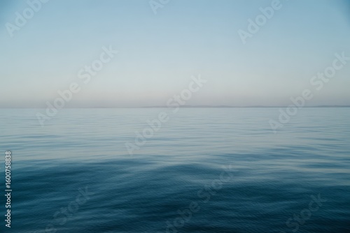 Calm ocean horizon with gentle waves water