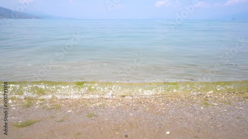 Ripples along the shore of Ohrid Lake in Pogradec, Albania. -June 13, 2025.