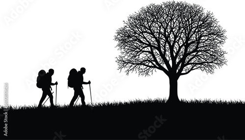 Two backpackers with hiking poles traversing a grassy landscape towards a large silhouette tree, symbolizing adventure, nature exploration, trekking, and the journey outdoors.