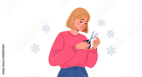 Crafty winter activity: Young woman creates delicate paper snowflakes with scissors with a touch of seasonal magic and festive anticipation