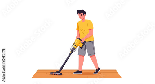Young man doing housework cleaning a wooden floor with a cordless vacuum cleaner indoors