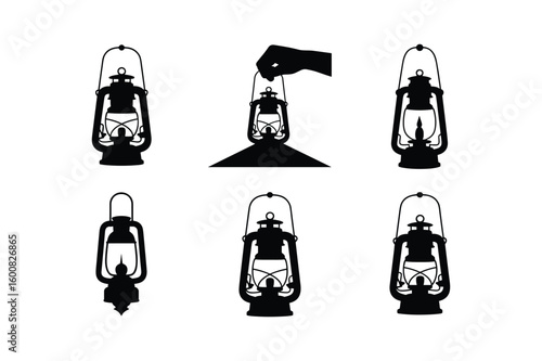 Collection of vintage kerosene lamps and a hand holding oil lamp lantern