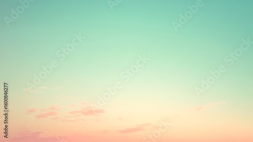 Pastel sunset sky with soft clouds and gradient colors creating a dreamy atmosphere