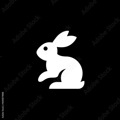 Minimalist rabbit icon poses quietly against stark dark background graphic simplicity