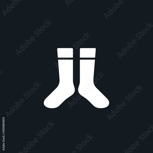 Two socks appear isolated against a solid dark background showcasing simplicity design