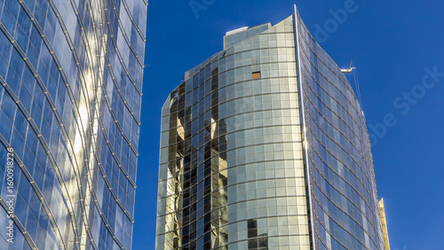 Look up panoramic and perspective view to steel glass high rise building skys...