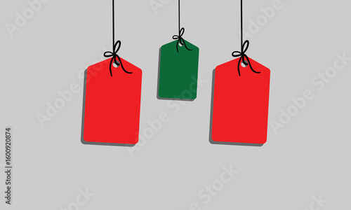 White rectangular tag with rounded corners hanging from a string with a bow on a soft background