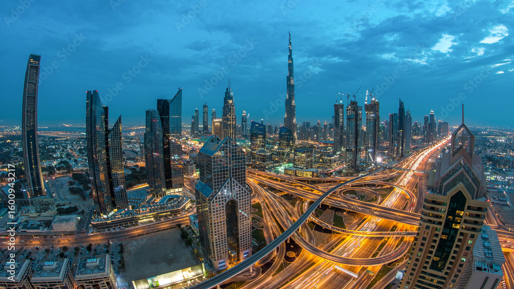 Obraz premium Modern skyscrapers and busy evening highways day to night timelapse in luxury Dubai city, Dubai, United Arab Emirates