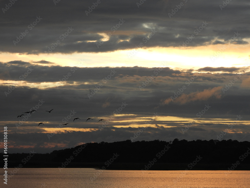 Fototapeta premium The tranquil beauty of the wetlands, as the sun sets. Bombay Hook National Wildlife Refuge, Kent County, Delaware. Remnants of tropical storm Debby.