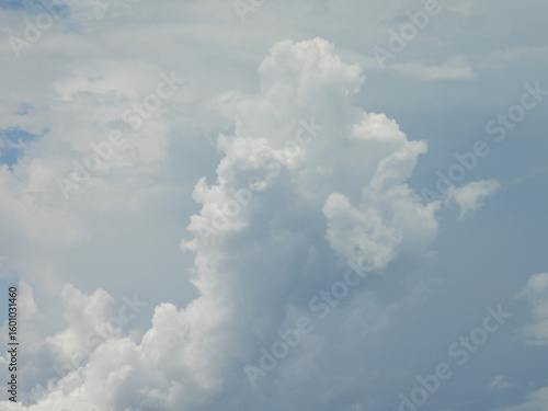 Valokuvatapetti Cumulonimbus clouds, thunderheads forming within a blue sky, over Kent County, Delaware