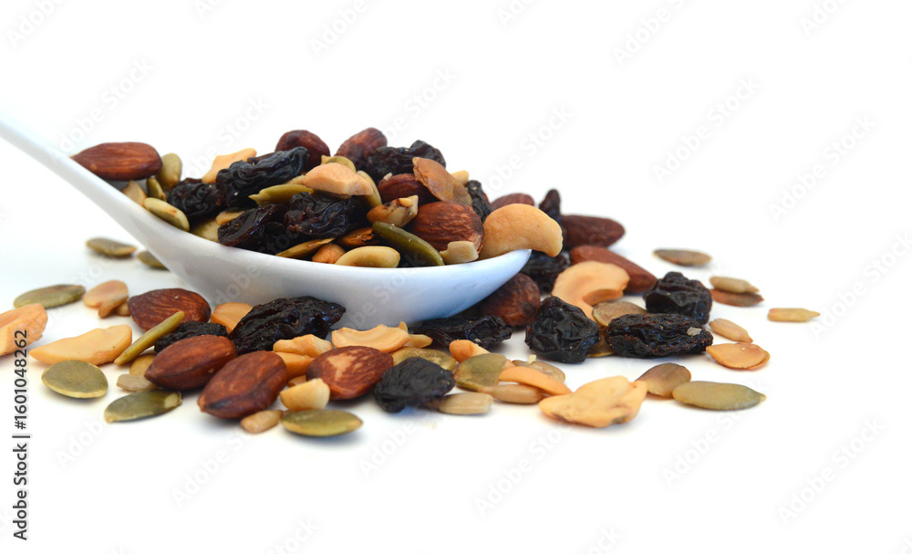 Obraz premium Mix nuts, dry fruits and grapes on a white background