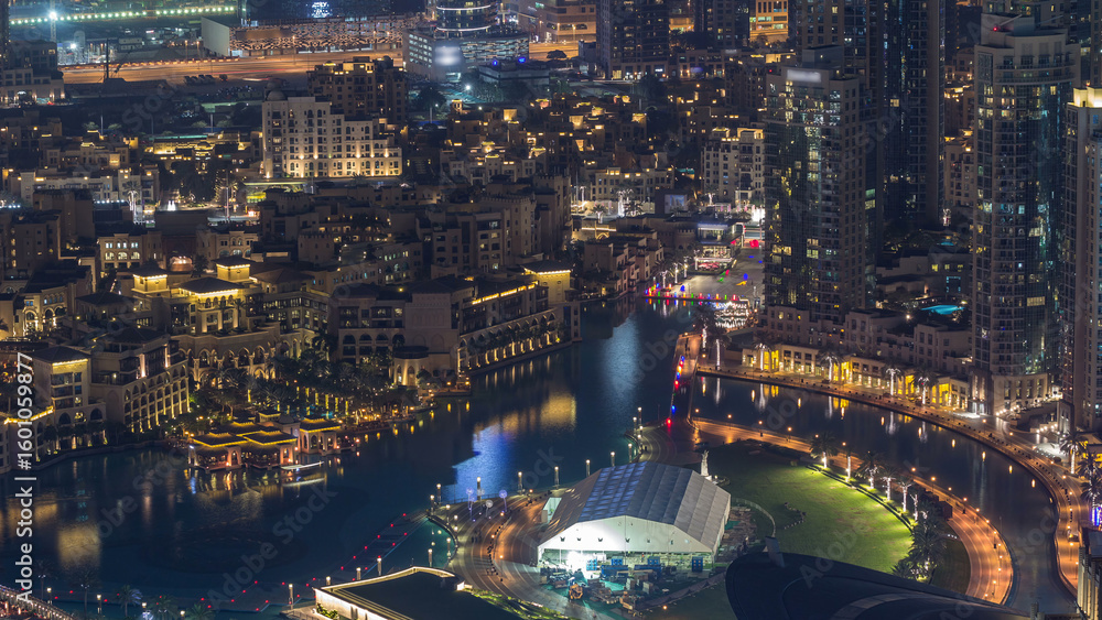 Fototapeta premium Dubai Downtown night timelapse modern towers panoramic view from the top in Dubai, United Arab Emirates.