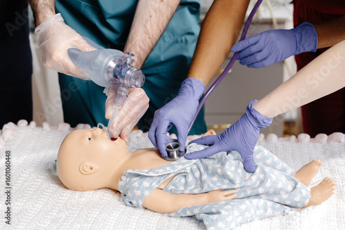 Medical Students Practicing Intubation Technique on Baby Mannequin during Training