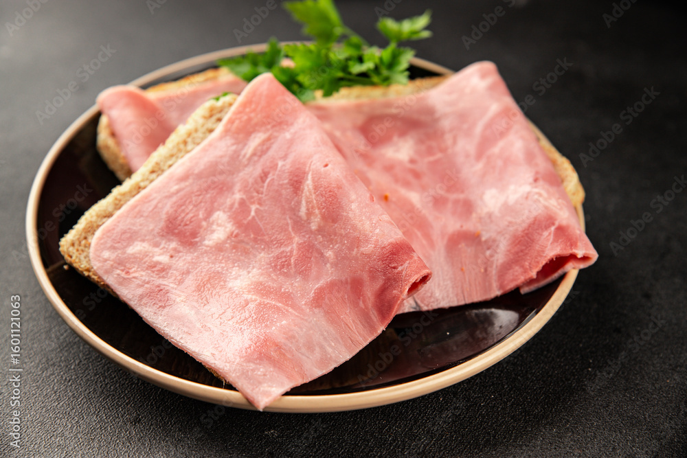 Fototapeta premium Ham slices meat spam pork fresh delicious gourmet food background on the table rustic food top view copy space