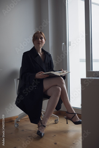 young business woman sitting on chair