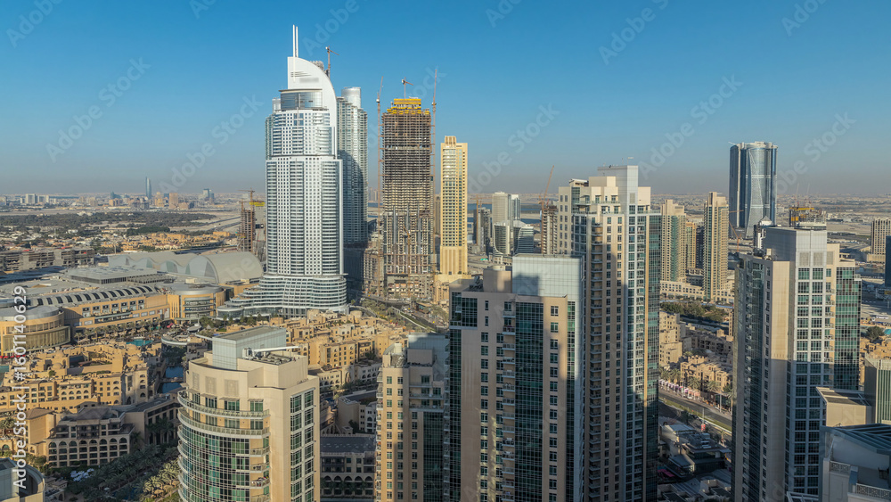 Fototapeta premium Dubai downtown in the evening timelapse in bright yellow sunset light