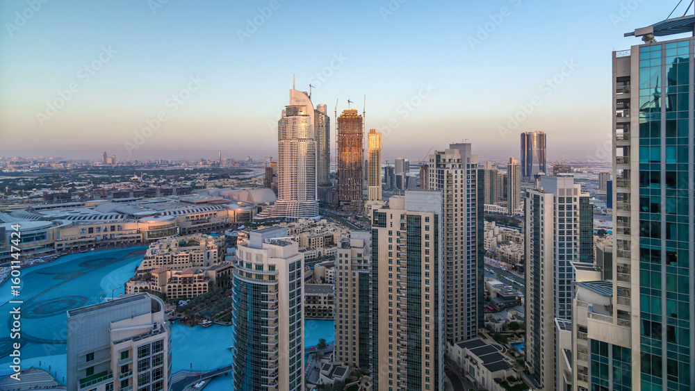 Fototapeta premium Dubai downtown in the evening timelapse in bright yellow sunset light