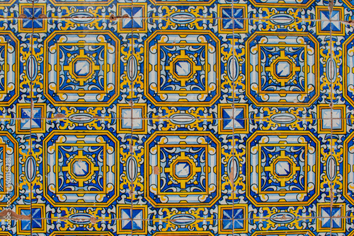 background with decorative tiles in blue and yellow in Spanish style