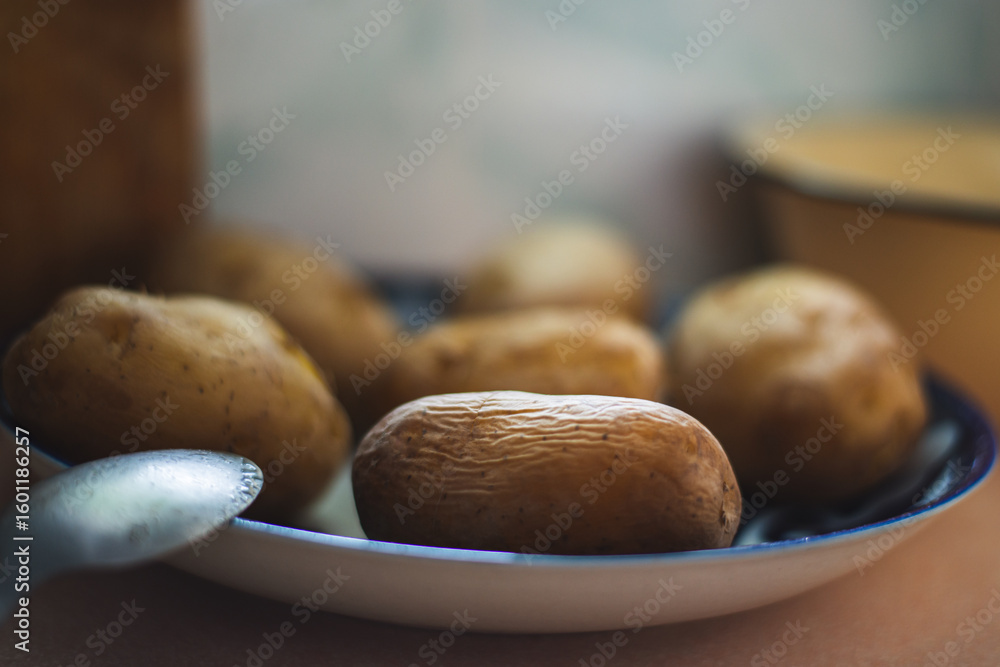 Boiled potatoes in the skin on a large plate. High quality photo Boiled potatoes in the skin on a large plate. High quality photo