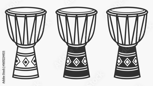 Three djembe drums in a row with decorative bands