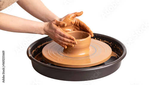Close-up of hands shaping clay on a pottery wheel isolated on white background.