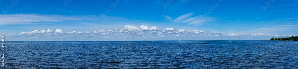 Obraz premium Beautiful views open up along the shore of the Kiev Sea, Ukraine, showcasing the peaceful harmony of water and nature.