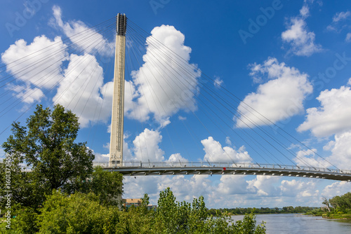 The Bob Kerrey Pedestrian Bridge crosses over the Missouri river, connecting Omaha, Nebraska with Council Bluffs, Iowa