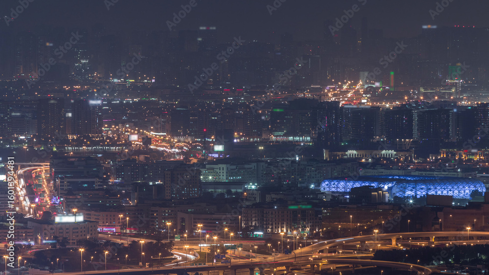 Obraz premium Aerial view of neighborhood Deira and Dubai creek with typical old and modern buildings night timelapse.