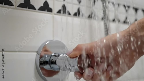 Close-up of Shower Head Turning On and Off with Flowing Water Droplets