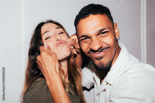 Playful couple making funny faces together