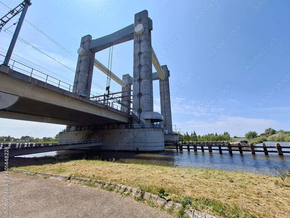 Vertical lift bridse Hoge Gouwespoorbrug over the Gouwe Canal in Gouda city Vertical lift bridse Hoge Gouwespoorbrug over the Gouwe Canal in Gouda city