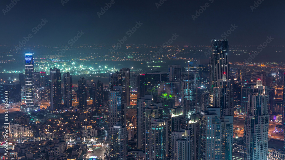Fototapeta premium Amazing aerial view of Dubai downtown skyscrapers night timelapse, Dubai, United Arab Emirates