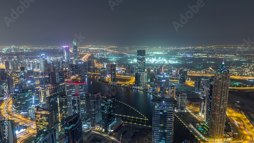 Wallpaper Mural Panoramic aerial view of business bay towers in Dubai night timelapse. Torontodigital.ca