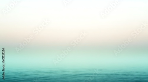 Serene sea view with gradient sky backdrop creating a peaceful coastal landscape