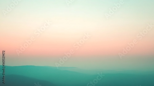 Serene mountain landscape with soft pastel sky at sunrise. Calming nature scenery