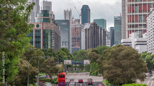 Traffic with cars on a street and urban scene in the central district of Sing...