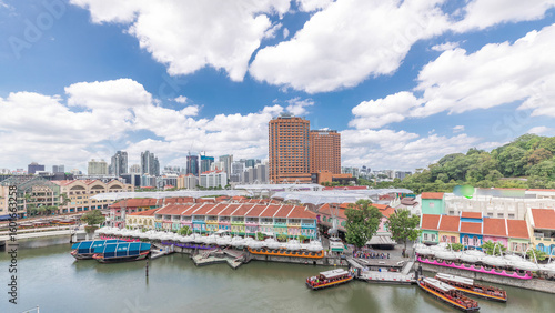 Photography Tourist boats docking at Clarke Quay habour aerial timelapse.