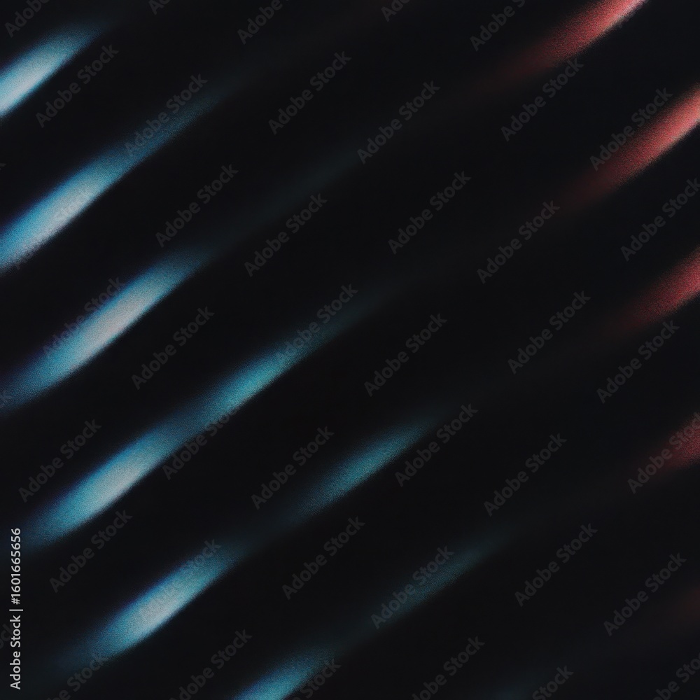 Obraz premium Abstract streaks of light in shades of blue and red on a dark background showing movement and energy.