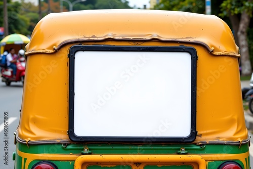 Tuk-Tuk Back Billboard: A vibrant tuk-tuk, showcasing a blank billboard on its rear, perfect for custom advertisement and commercial promotion, navigating through the city's lively streets.