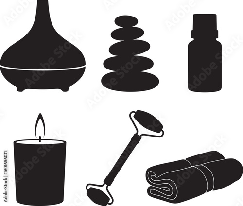 Relaxation and wellness items including a diffuser stones oil candle roller and towels